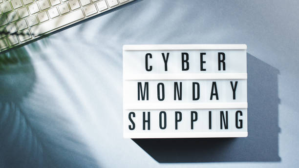 istock Cyber monday shopping background on office table 1438190328