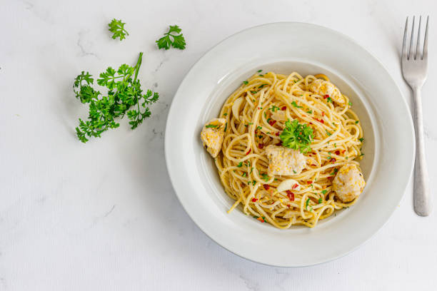 istock Chicken Spaghetti Garnished with Fresh Parsley 1438193098