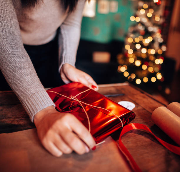 istock woman making the package for the christmas gift 1438193456