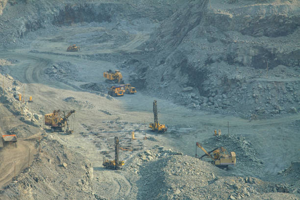 istock Part of the open-pit iron ore mining process. Operation of drilling rigs, excavators, dump trucks . 1438193468