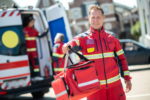 istock Middle-aged ambulance doctor finishing his day shift 1438194867