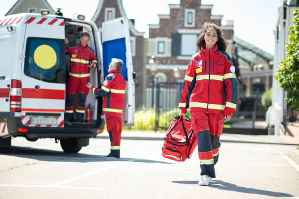 istock Cheerful young paramedic arriving for her day shift 1438194872