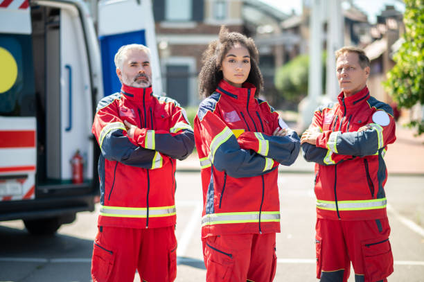 istock Ambulance doctors in uniforms near an EMS vehicle 1438194882