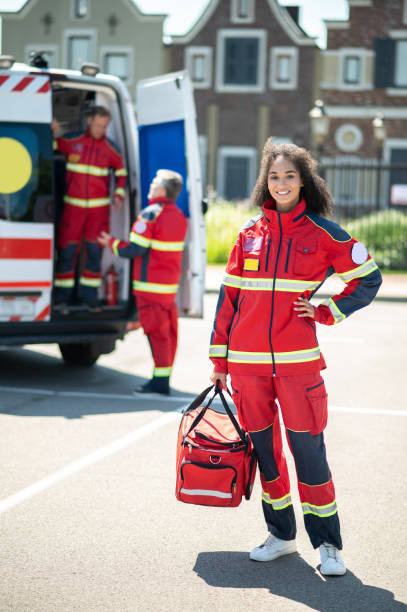 istock Cheerful young female paramedic ready for work 1438194895