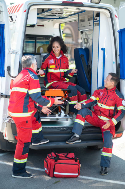 istock EMS workers in the red uniforms involved in a conversation 1438194909