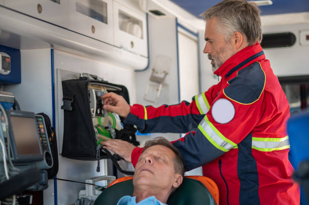 istock Ambulance physician preparing the patient for oxygenation 1438194933