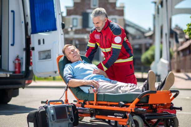 istock Concentrated ambulance doctor assessing the patient condition 1438194940