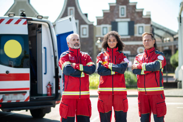 istock Paramedical staff posing for the camera near an ambulance 1438194975