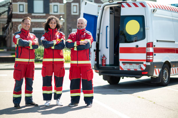 istock Joyous paramedics in the uniforms standing outdoors 1438194983