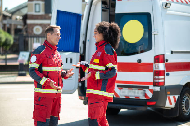 istock Cheerful ambulance doctors having a conversation outdoors 1438194994