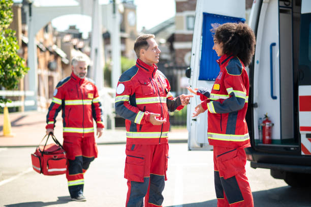 istock Paramedical personnel having a conversation before the work shift 1438195010