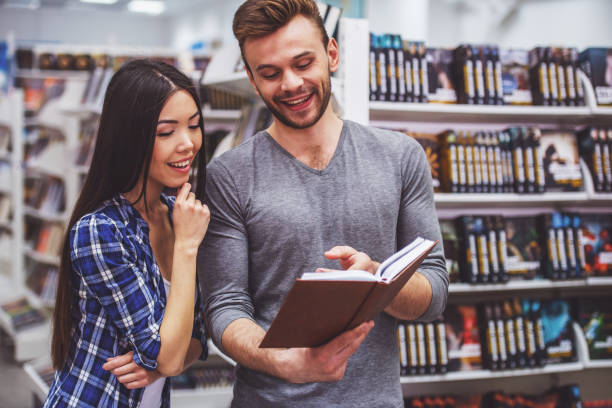 istock Young people at the book shop 1438198246