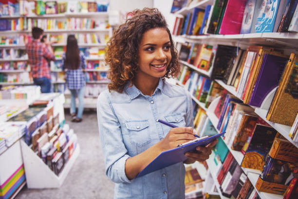 istock Young people at the book shop 1438199121
