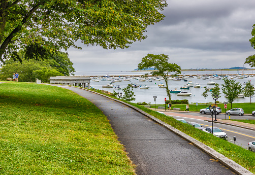 Plymouth, Massachusetts, USA - September 12, 2022: . View of the harbor under cloudy skies walking the path up to Coles Hill.