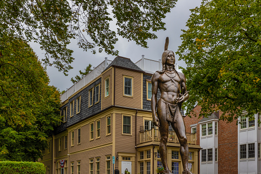 Plymouth, Massachusetts, USA - September 12, 2022: . National Historic Landmark location since 1935 stands a statue erected in 1921 of an Indian Massasoit Great Sachem of the Wampanoags Protect and Preserver of the Pilgrims 1621