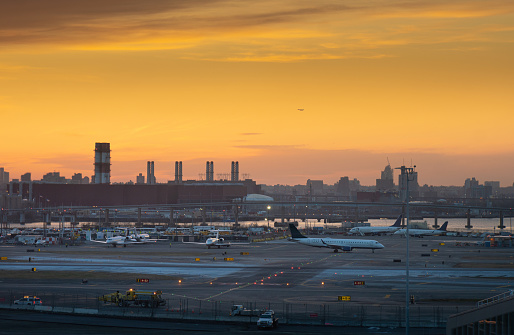 New York City airport and runway with skyline silhouette
