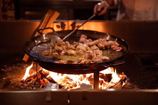 istock Traditional Paella high wooden flames 1438200042