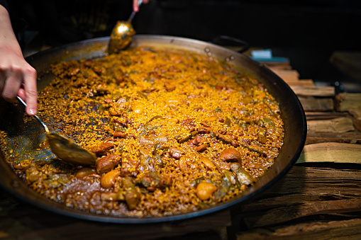 Serving a portion of traditional Valencia Paella