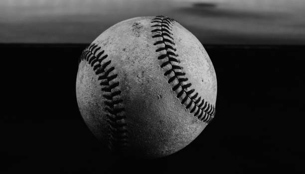 istock texture of baseball ball on dark background 1438200747