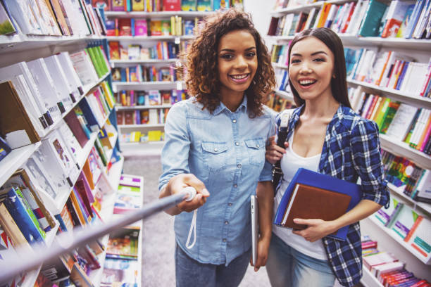 istock Young people at the book shop 1438200832
