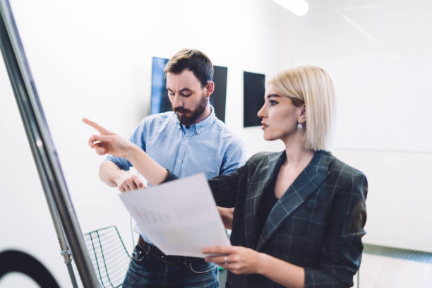 istock Business people discussing financial results in office 1438201176