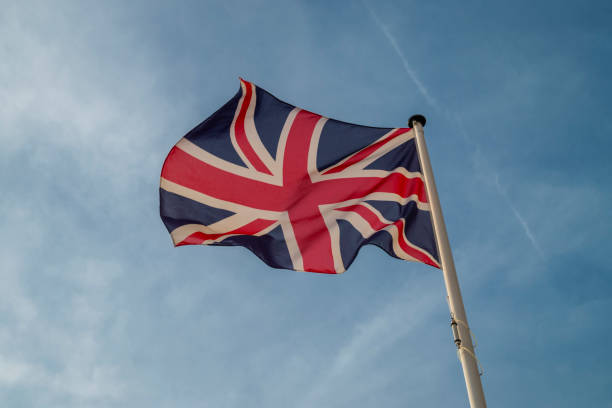 istock british flag flying against the sky 1438202501