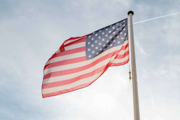 istock usa state america flag flying against the sky 1438202505