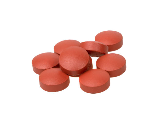 istock Red medcine pills round circle isolated on the white background 1438203766