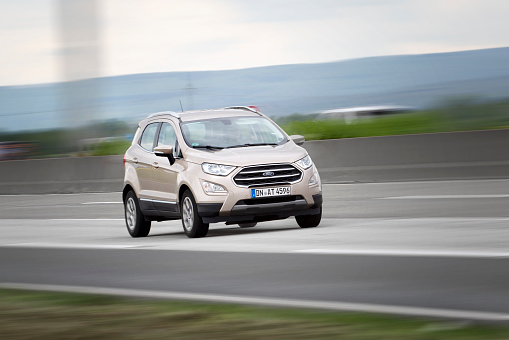 Diedenbergen, Germany - May 12, 2021: Ford EcoSport on German highway A3 nearby wiesbaden. Ford EcoSport subcompact crossover SUV, originally built in Brazil by Ford Brazil since 2003. Ford is an american multinational automobile manufacturer based in Detroit and was founded by Henry Ford in 1903