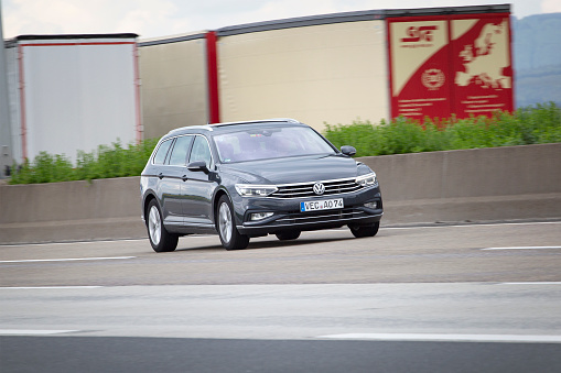 Diedenbergen, Germany - May 12, 2021: VW Passat B8 on a highway nearby Wiesbaden, Germany. The VW Passat is a station wagon, produced by VW. VW is a brand of the Volkswagen Group, which is a German automobile manufacturing group based in Wolfsburg, Germany and founded in 1937