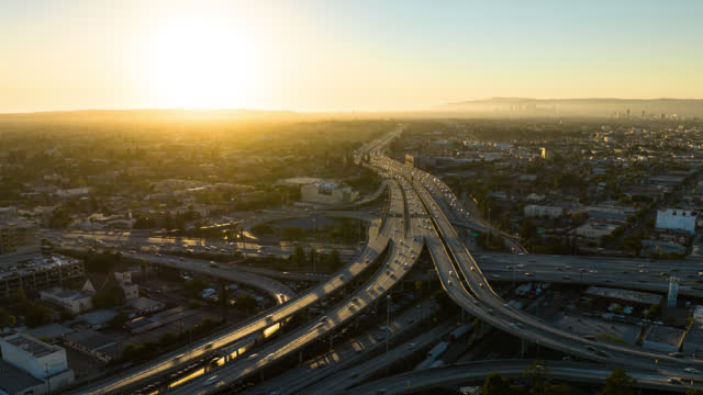 10/110 Freeway Interchange in Los Angeles California at Sunset - Aerial Time Lapse