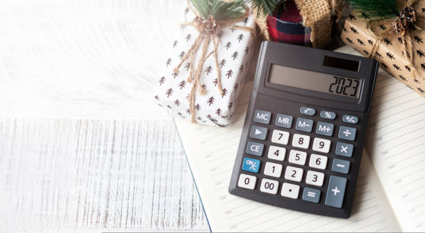 istock New Year's layout with calculator, Santa's hat and Christmas decorations 1438206266
