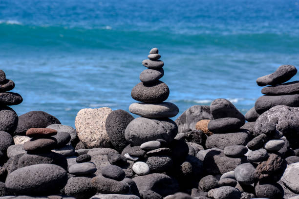 istock Stack of stones on the sea beach 1438208063