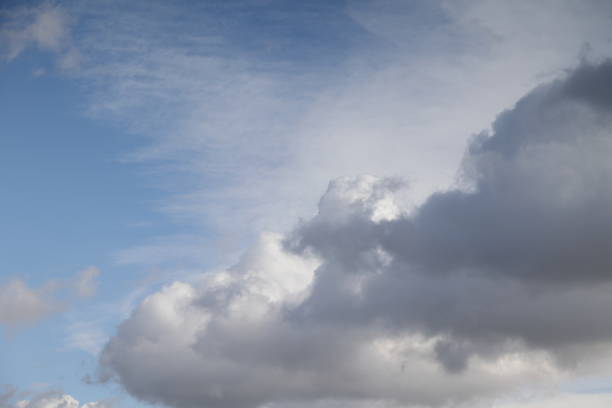 Large, grey clouds approach before a sudden rain shower over Metro Vancouver, British Columbia. Autumn afternoon.