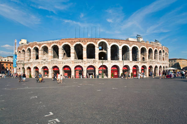 famous arena in Verona Verona, Italy - August 5, 2009: people in front of Arena in verona, famous old roman amphie theater in Verona, Italy. Popular spot for Verdi operas. verona opera stock pictures, royalty-free photos & images