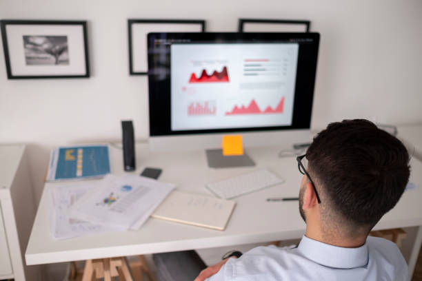 istock Business accounting concept, Business man using calculator with computer laptop, budget and loan paper in office. 1438210686
