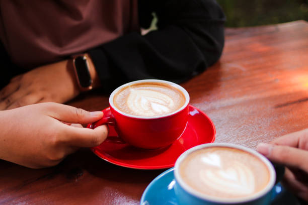 istock Young couple in love having breakfast in a coffee shop 1438210962
