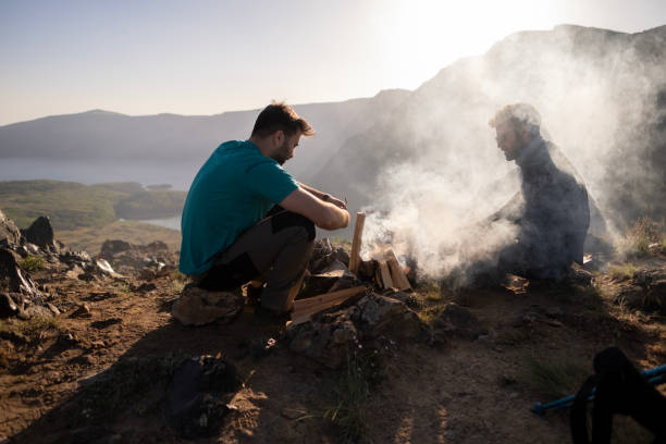 istock Hands of hikers cheering up with camping cups 1438210987