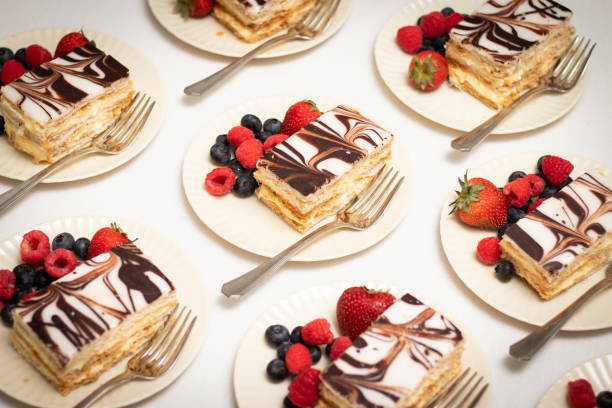 Plated Napoleon dessert pastries in rows