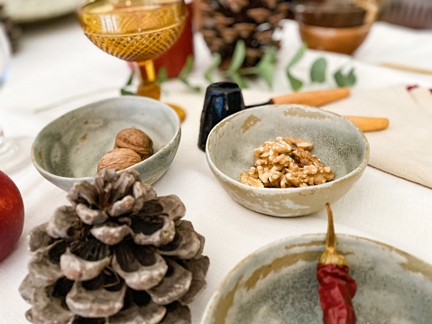 Cozy Christmas table set at home with natural elements