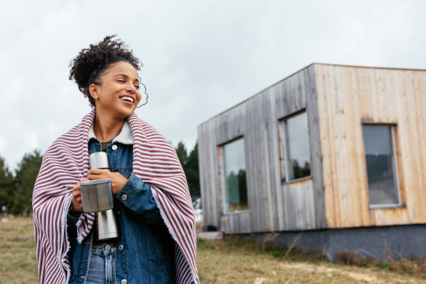 istock Happy woman at mountain cabin. 1438212065