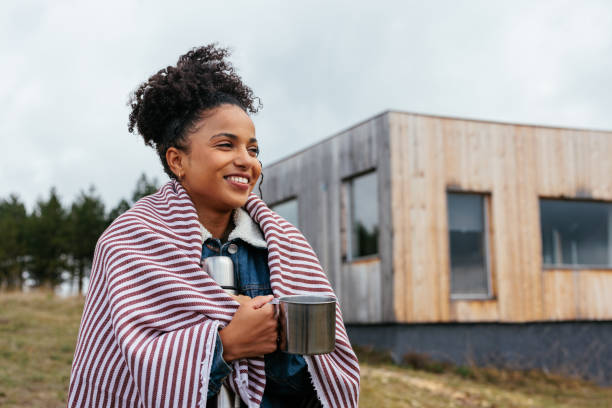 istock Woman on trip at mountain cabin. 1438212175