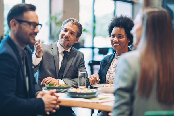 istock Business persons talking during a lunch 1438213572