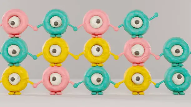 Tower of funny characters made of plasticine holding hands