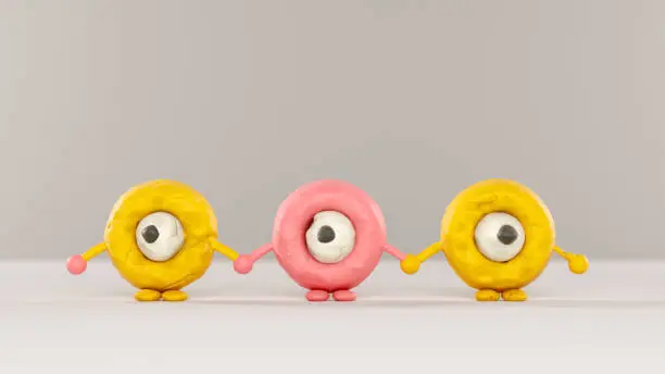 Funny characters made of plasticine holding hands