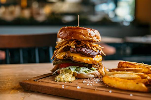 istock Closeup of an appetizing double-sized burger at a restaurant 1438214733