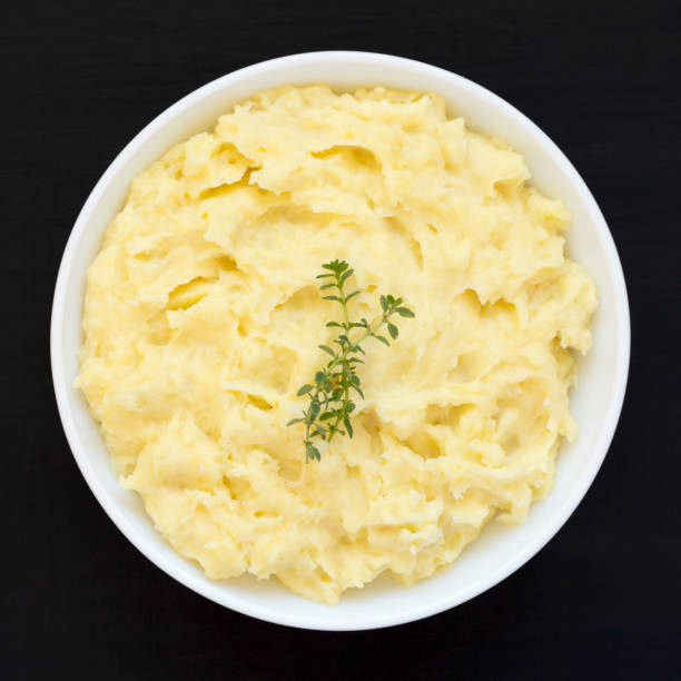 istock Homemade Garlic Mashed Potatoes on a black background, top view. Flat lay, overhead, from above. 1438214865