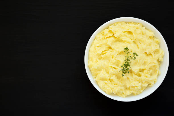istock Homemade Garlic Mashed Potatoes on a black background, top view. Flat lay, overhead, from above. Copy space. 1438214872