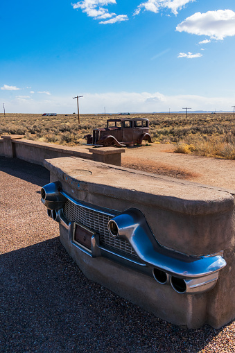 Petrified Forest National Park, AZ / USA - 4 March 2022: A 1932 Studebaker sits in scrubland along and old section of Route 66.