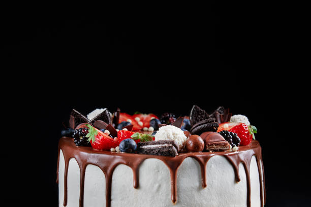 istock Cake decorated with strawberry and chocolate on dark background 1438216602